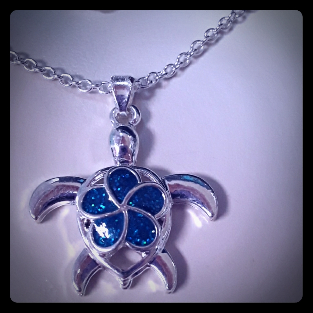 Turtle necklace with flower on its back